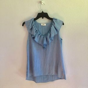 Denim ruffle top. Very good pre owned condition.